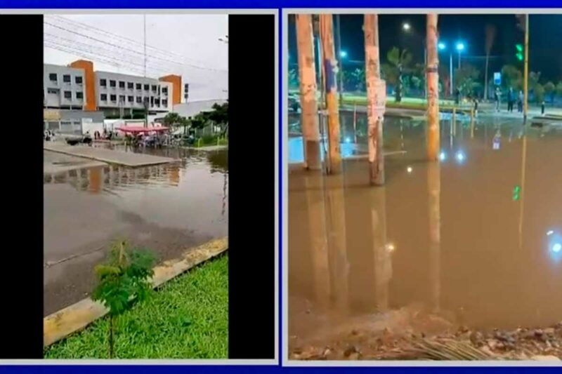 Acceso del Hospital de Emergencias de Villa El Salvador inundado con agua de desagüe, con pacientes caminando entre el agua contaminada